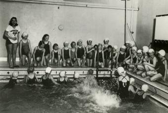 Historic photo of girls swimming at the YMCA